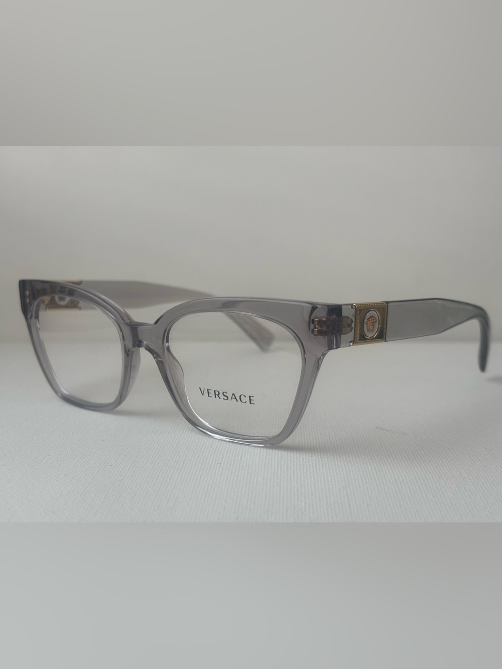 Versace Women's Translucent Gray Square Glasses with Gold Medusa Temples